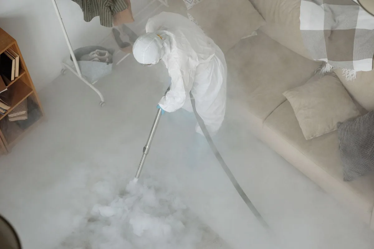 Biohazard cleanup technician in protective equipment, West Leechburg, PA